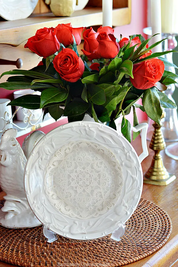 Cottage Style Doily Decor DIY Cottage Style Doily in a plate stand layered over a white plate near roses in a white pitcher